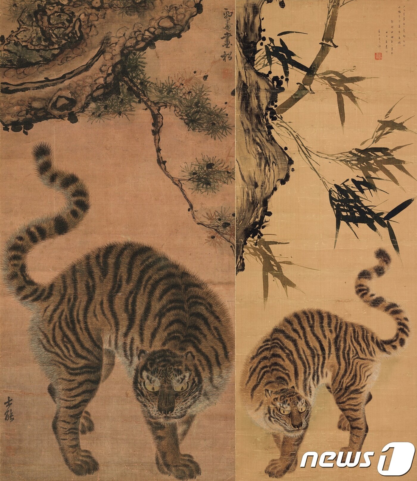본문 이미지 - (왼쪽)'소나무 아래 호랑이'(松下猛虎圖), 김홍도金弘道(1745~1806년경), 조선, 18세기, 비단에 먹과 옅은 색, 90.3&times;43.8cm, 삼성미술관 리움 소장(오른쪽)'대나무 아래 호랑이'(竹下猛虎圖), 김홍도金弘道(1745~1806년경), 임희지林熙之(1765~1820년 이후), 조선, 19세기 초, 비단에 먹과 옅은 색, 91.0&times;34.0cm, 개인 소장 ⓒ News1