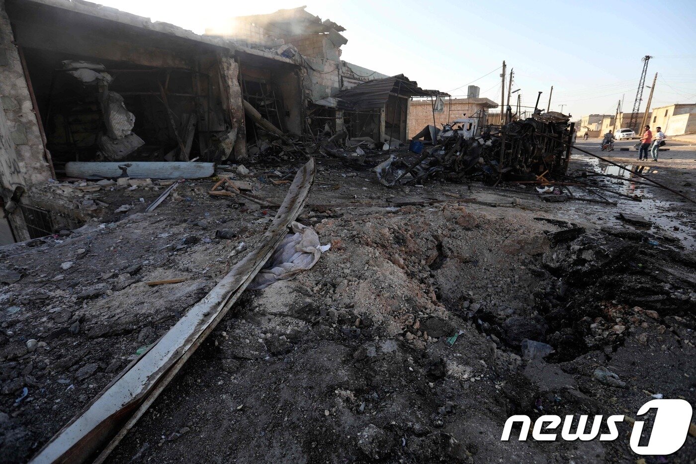 정부군 폭격으로 잿빛으로 변한 카프르 할랍의 민가. ⓒ AFP=뉴스1