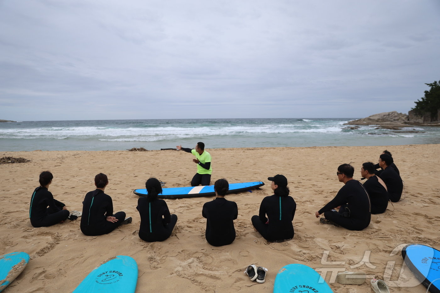 Catching Waves and Saving Lives: Sokcho Coast Guard's Intense Surfboard Rescue Training Police officers from Sokcho Marine Police Station conducting surfboard rescue training