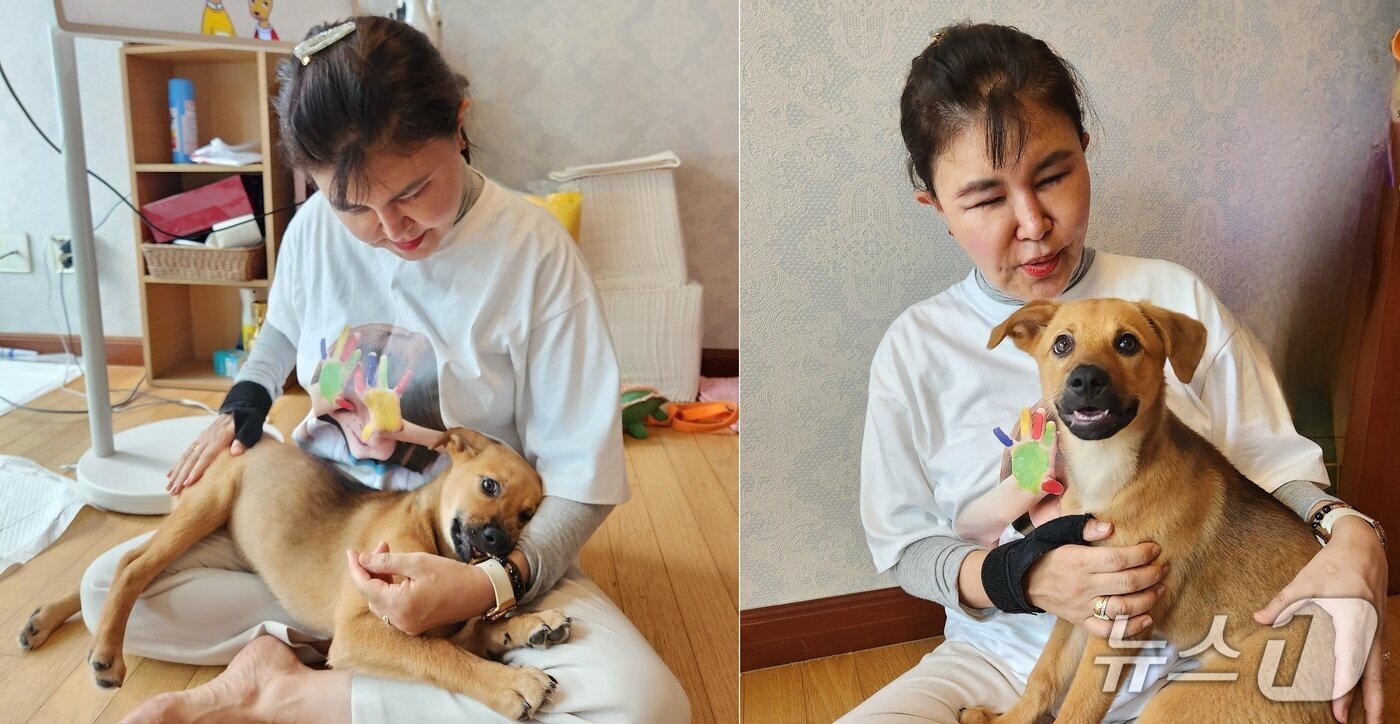 본문 이미지 - 강소영 서울디지털대학교 교수가 입양한 반려견 '칸초'와 사진을 직고 있다. ⓒ 뉴스1