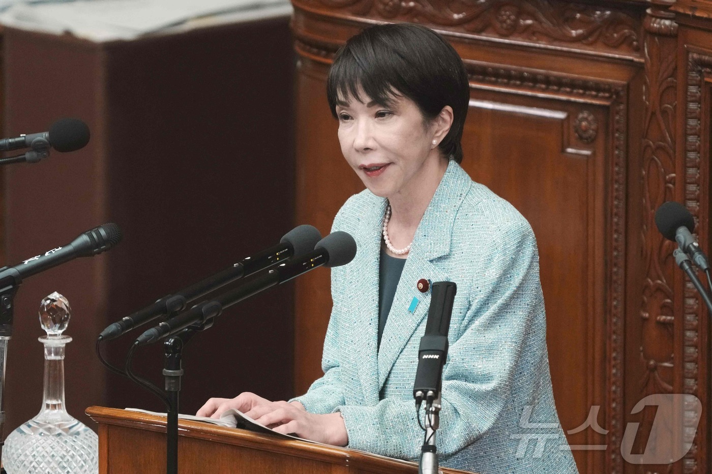 (도쿄 AFP=뉴스1) 이정환 기자 = 8일 일본 도쿄 국회에서 열린 중의원 본회의에서 다카이치 사나에 일본 총리가 야당 의원의 질문에 답하고 있다. 2025.12.08.ⓒ AFP …