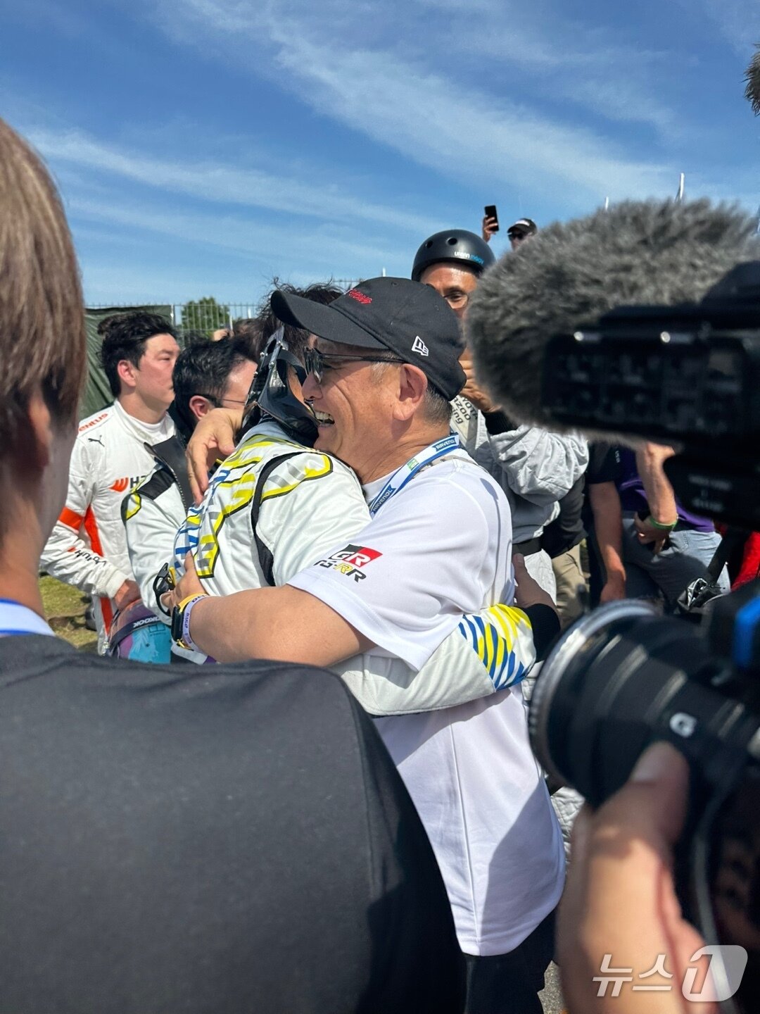 The photo shows Akio Toyoda, Chairman of Toyota Motor Corporation, embracing his eldest son, Daisuke Toyoda, immediately after the conclusion of the race. / Photo courtesy of the Toyota Gazoo Rookie Racing Joint Press Corps