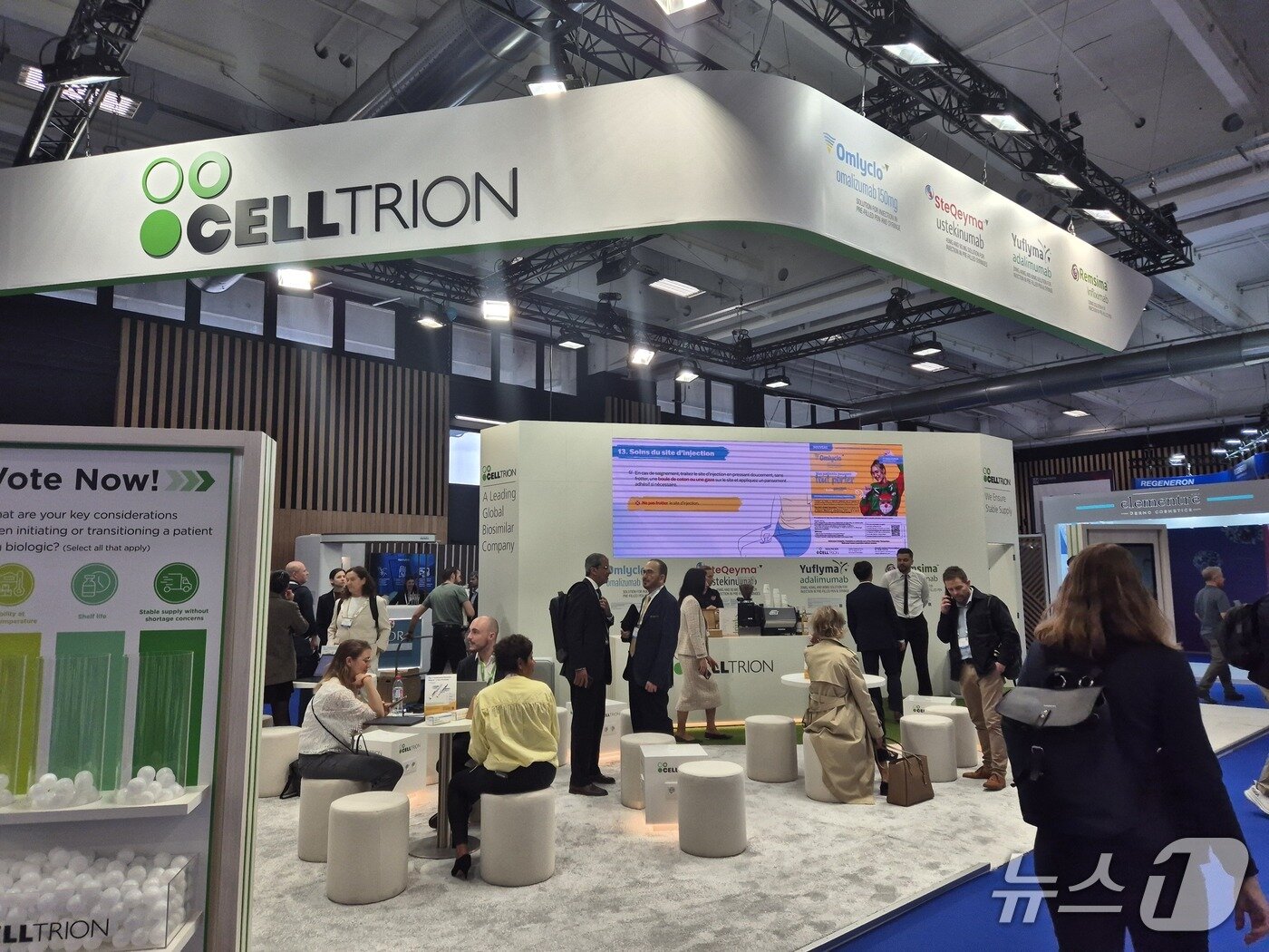 [EADV attendees explore the Celltrion booth] / News1
