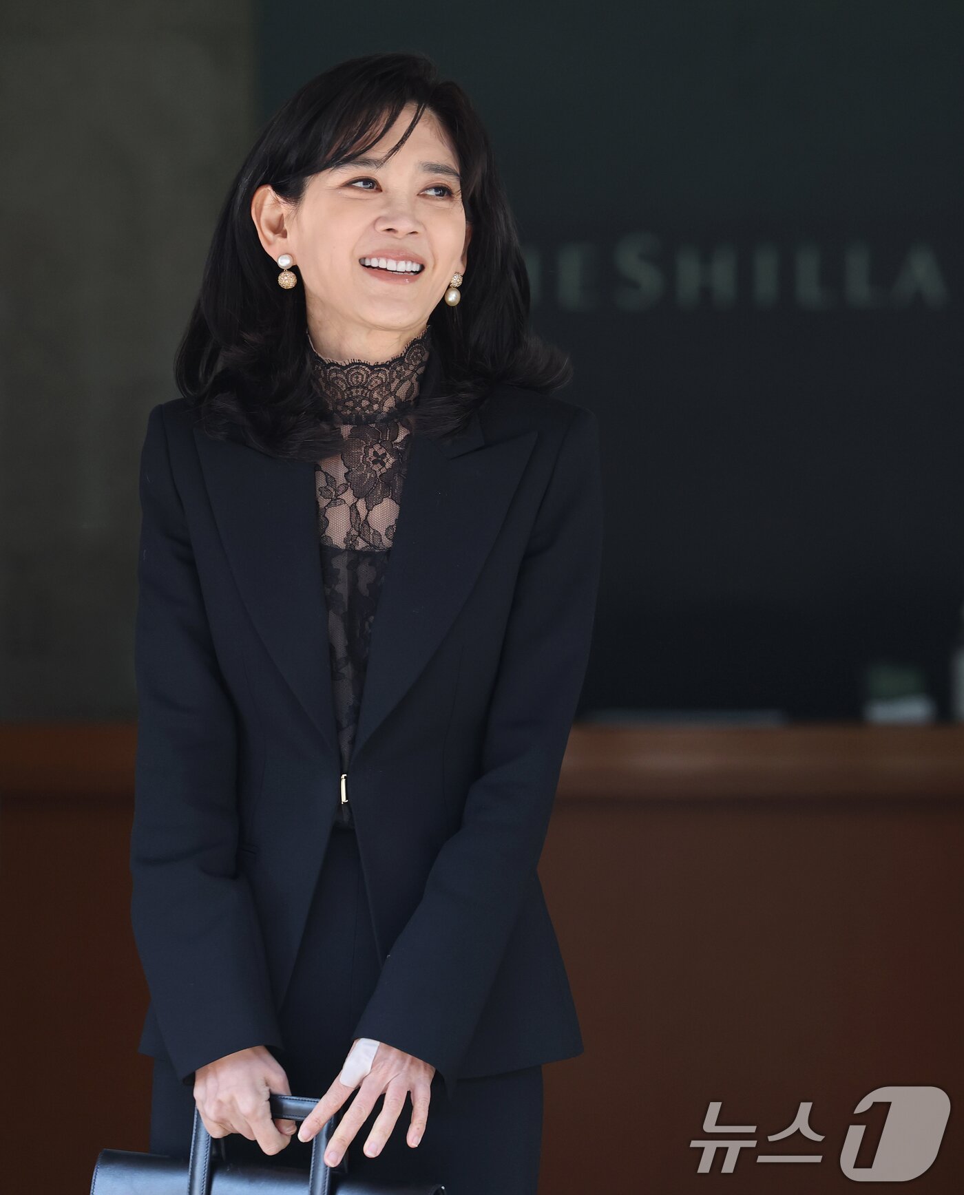 본문 이미지 - 이부진 호텔신라 사장이 19일 오전 서울 중구 삼성전자 장충동 사옥에서 열린 호텔신라 정기 주주총회에 참석한 후 이동하고 있다. 2026.3.19 ⓒ 뉴스1 오대일 기자