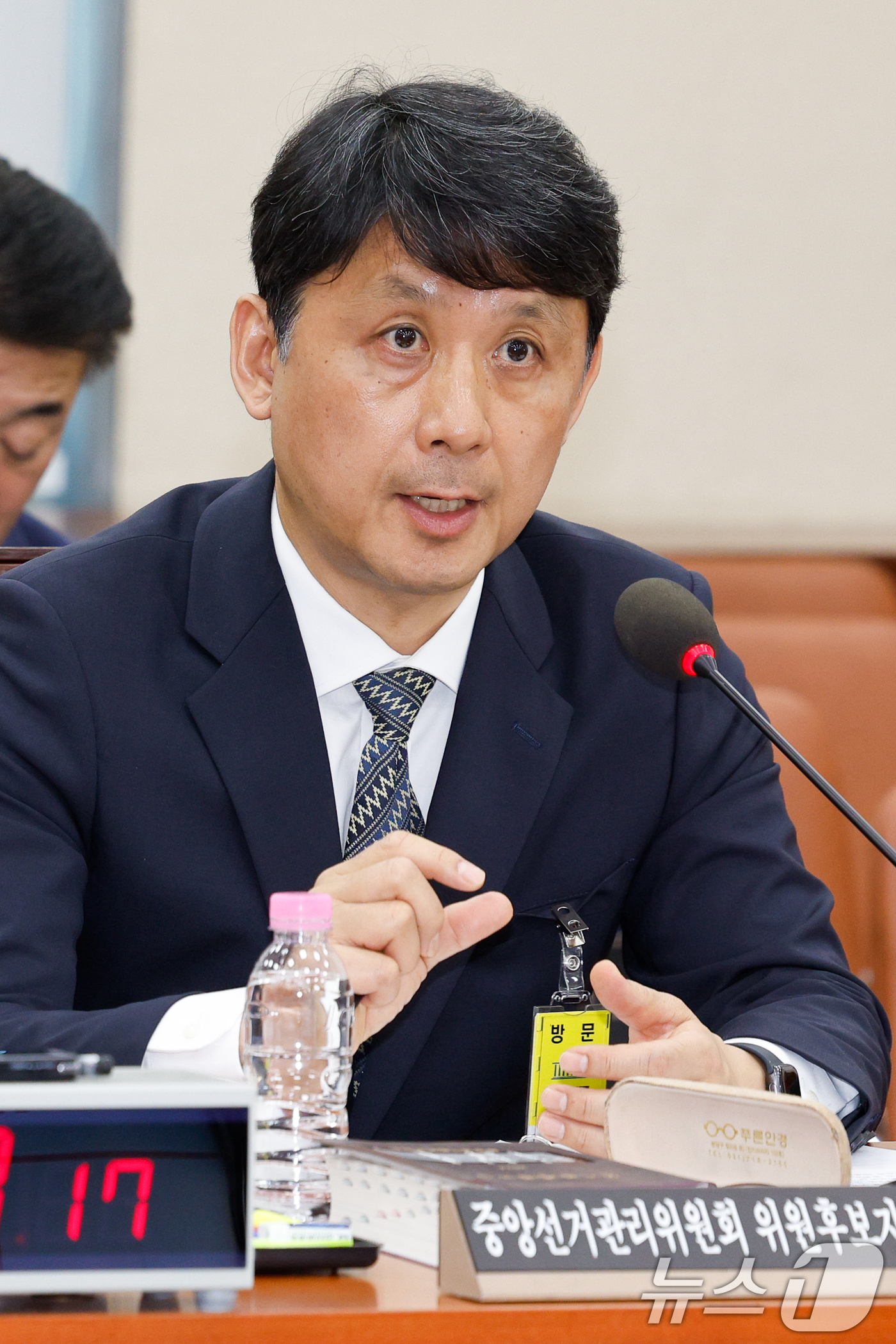 (서울=뉴스1) 안은나 기자 = 윤광일 중앙선거관리위원 후보자가 26일 서울 여의도 국회에서 열린 인사청문회에 출석해 의원 질의에 답하고 있다. 2026.3.26/뉴스1