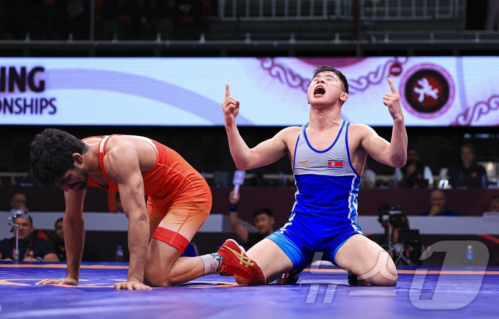 (평양 노동신문=뉴스1) = 북한 노동당 기관지 노동신문은 14일 김광명 선수가 2026년 아시아 레슬링 선수권대회에서 금메달을 땄다고 보도했다.[국내에서만 사용가능. 재배포 금지 …