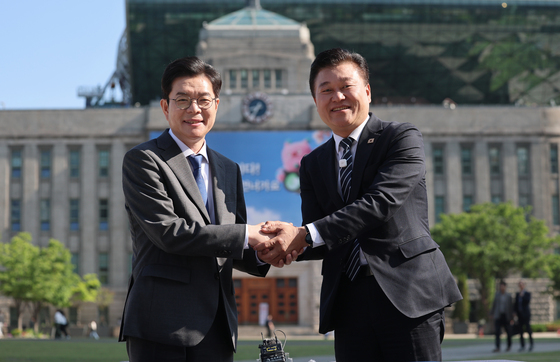 손 맞잡은 정원오·신용한