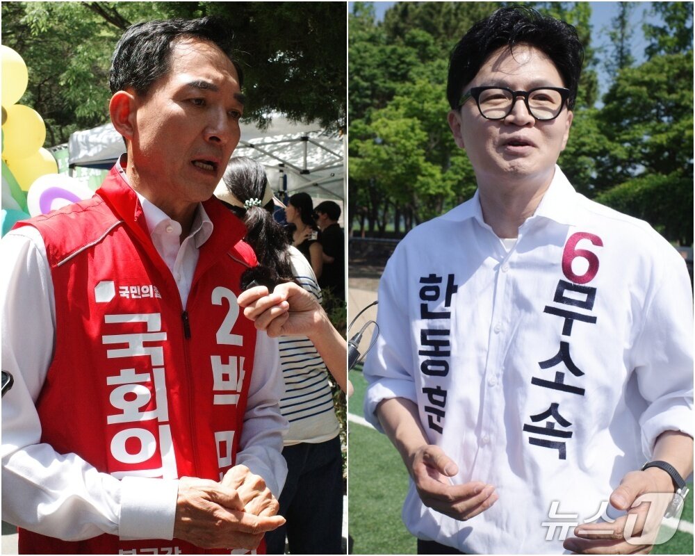 본문 이미지 - 부산 북구갑 국회의원 보궐선거에 출마하는 박민식 국민의힘 후보와 한동훈 무소속 후보. 2026.5.18 ⓒ 뉴스1 김세정 기자