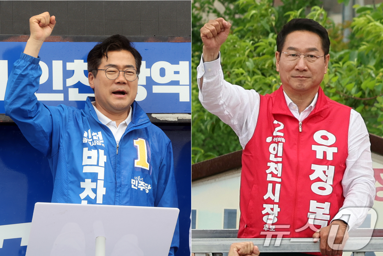 (인천=뉴스1) 황기선 기자 = 박찬대 더불어민주당 인천시장 후보(왼쪽)와 유정복 국민의힘 인천시장 후보가 27일 오후 인천 강화군 강화풍물시장에서 유권자들에 지지를 호소하고 있다 …