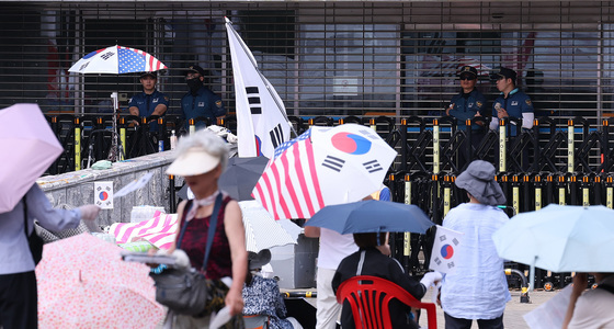 경찰, 올림픽공원 시위서 다른 참가자 폭행한 50대 현행범 체포