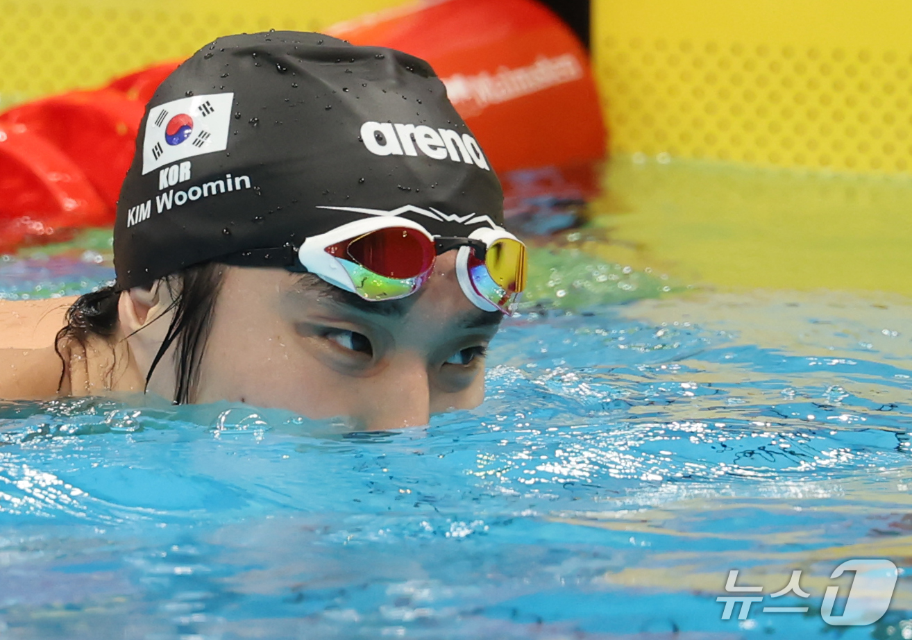 (도쿄=뉴스1) 김민지 기자 = 22일 일본 도쿄 아쿠아틱스 센터에서 열린 2026 아이치·나고야 아시안게임 수영 남자 1500m 결승 경기를 마친 김우민이 아쉬워하고 있다. 20 …